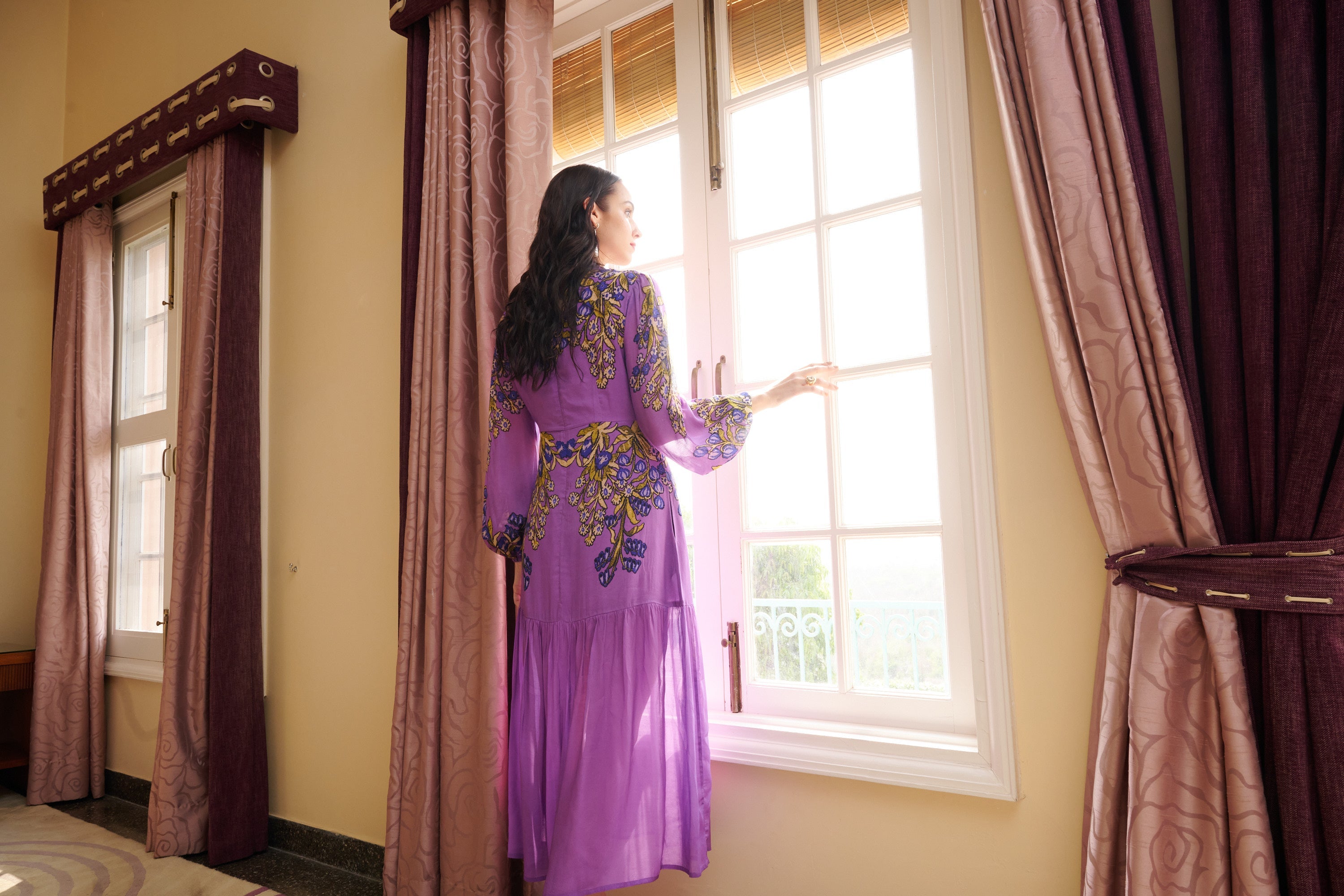 Back view of a woman wearing purple dress