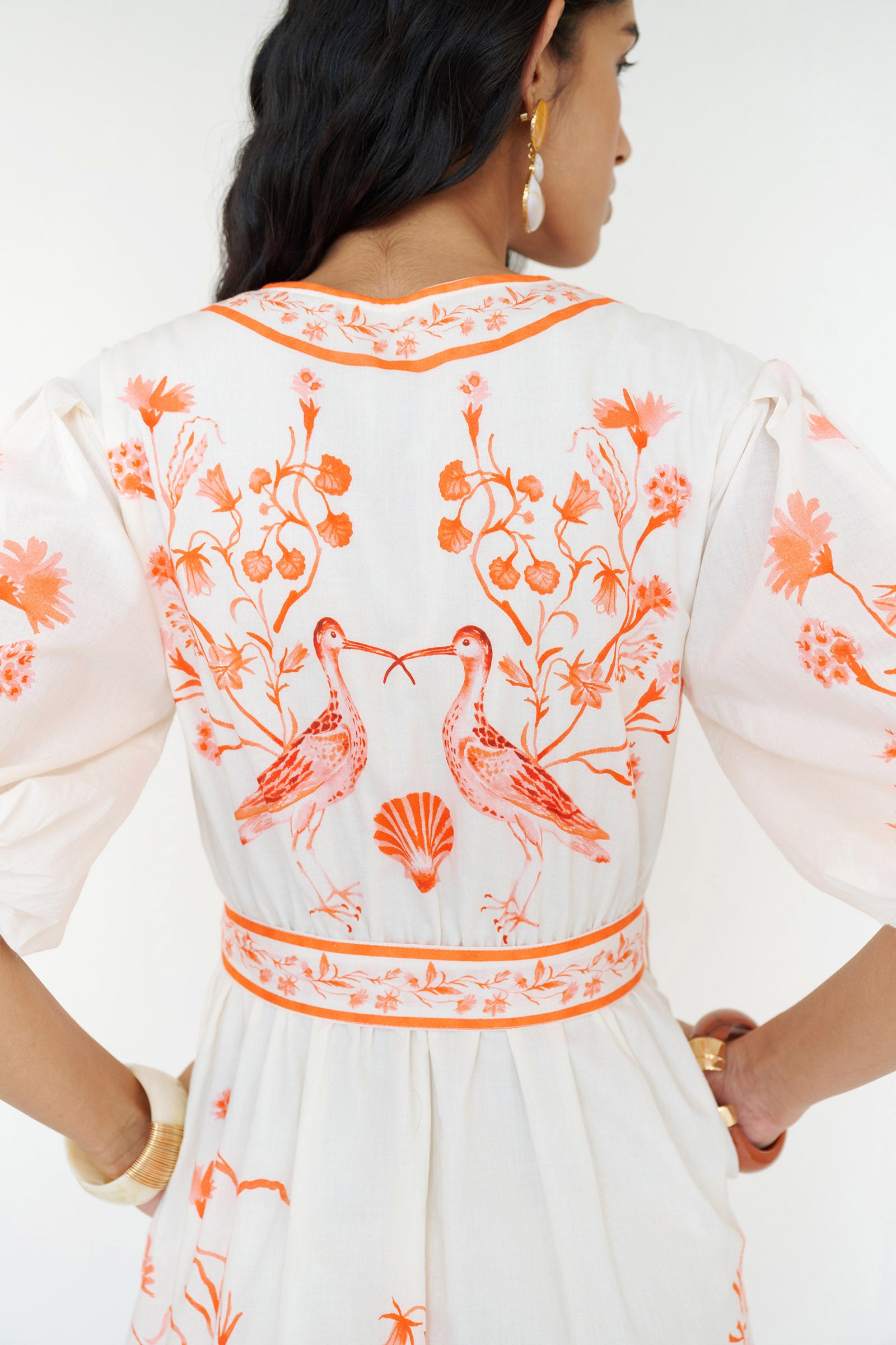 Back view close up of a woman standing wearing the Annabelle shirtdress in Tidepool placement print.