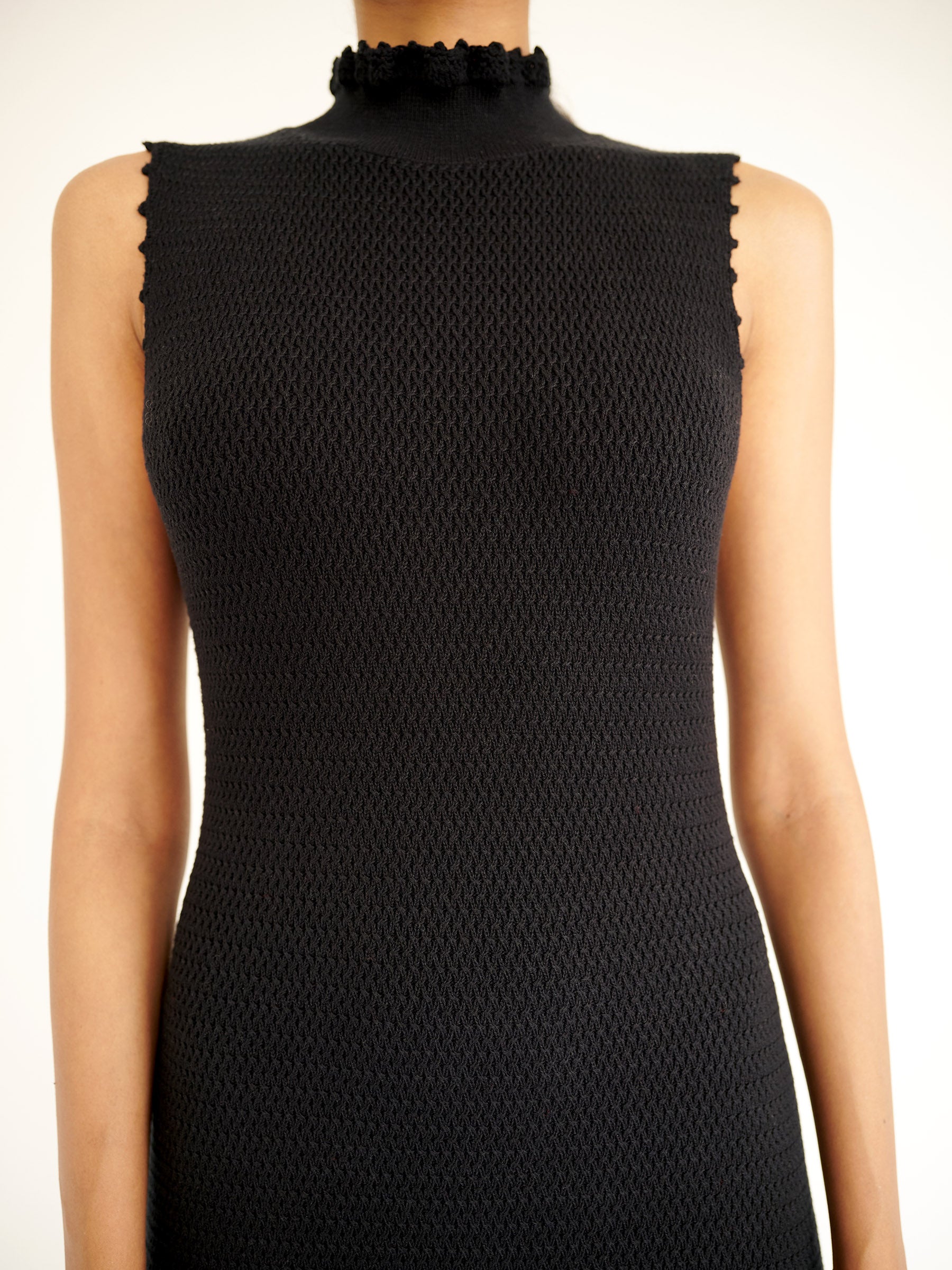 Front view close up of Amelia Fringe Dress showing the high neckline hand-crocheted trim.