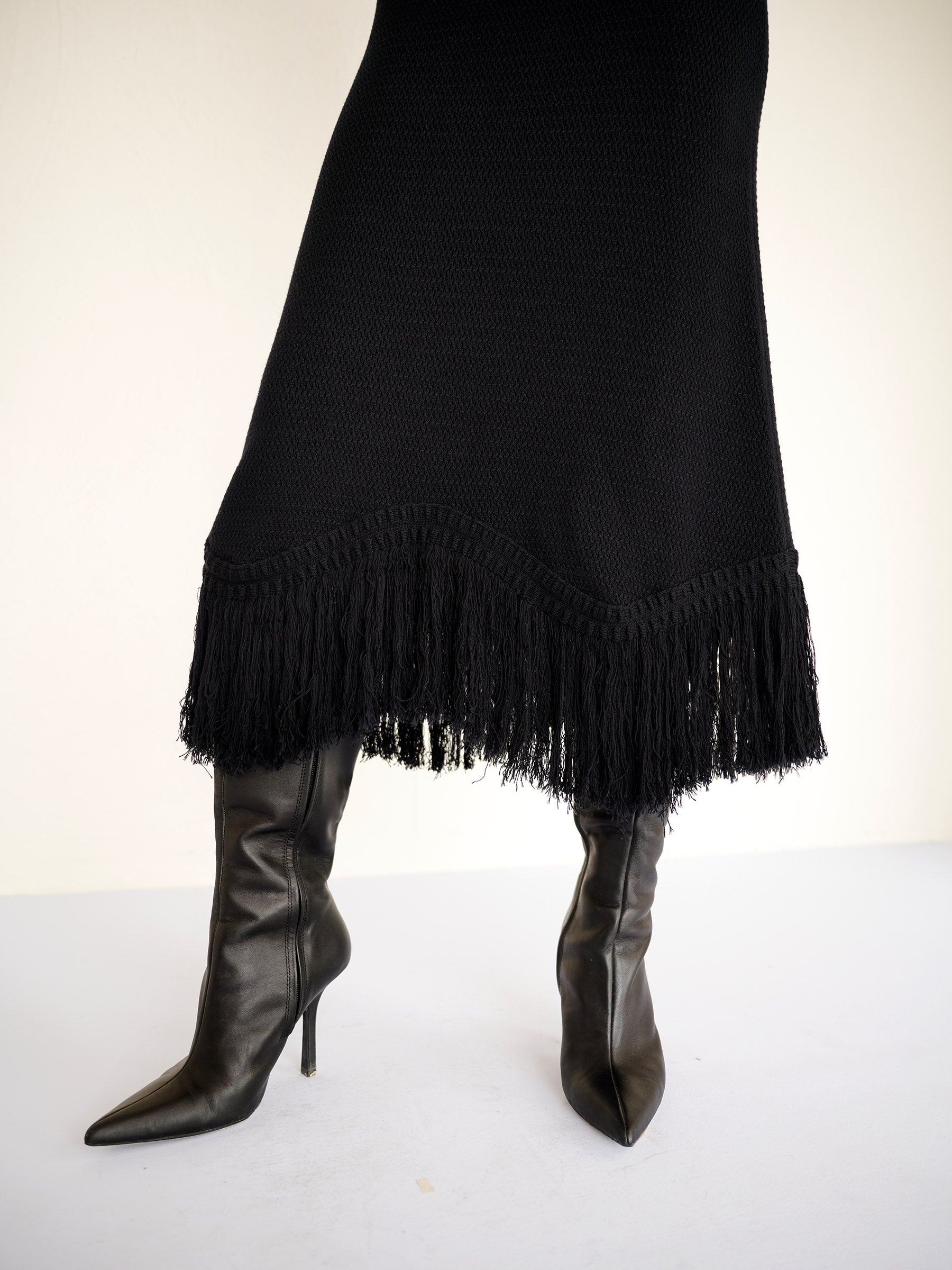 Front view close up of Amelia Fringe Dress showing the fringed asymmetrical hem.