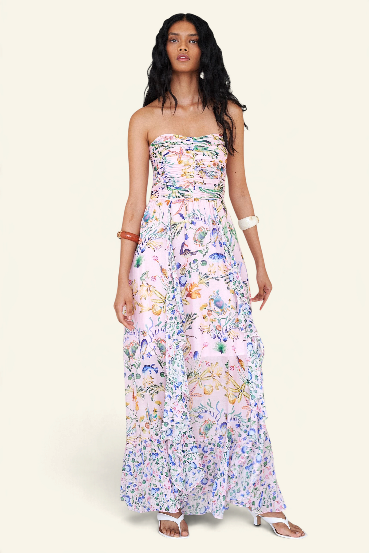 Banjanan Bella dress in Tidepool Conch print featuring a strapless ruched bodice and cascading ruffled skirt.