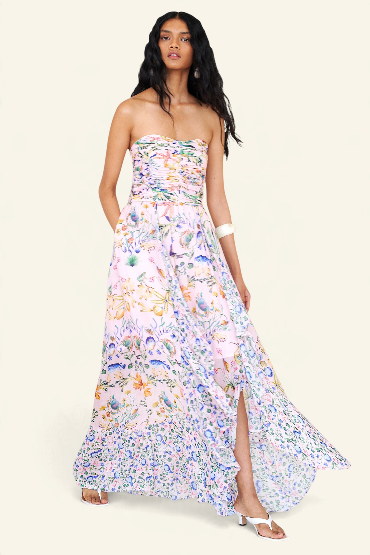 Banjanan Bella dress in Tidepool Conch print featuring a ruched bodice, cascading skirt, and sea-life motifs.
