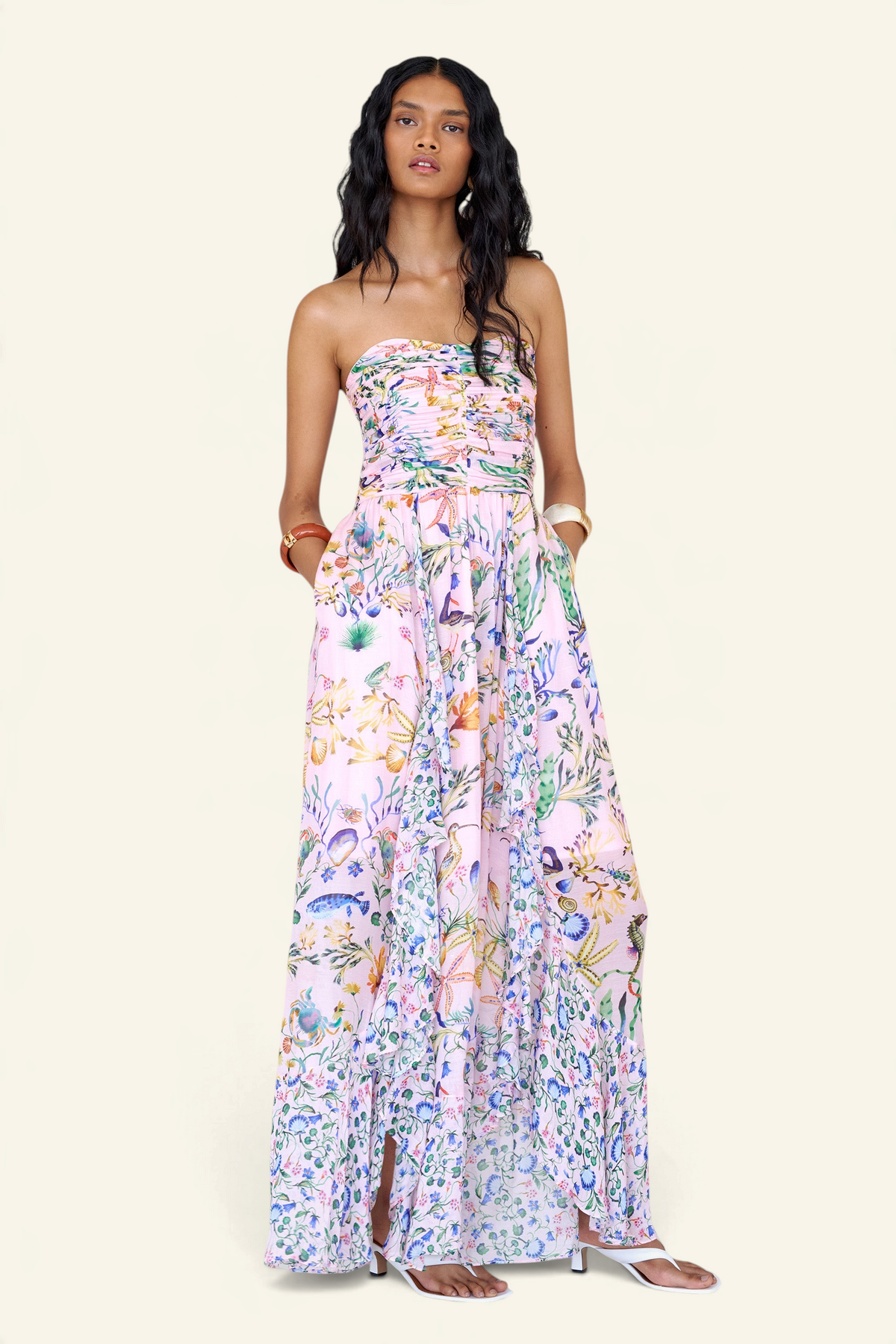 Banjanan Bella dress in pink Tidepool print with ruched bodice, cascading skirt, and conch shell detail.
