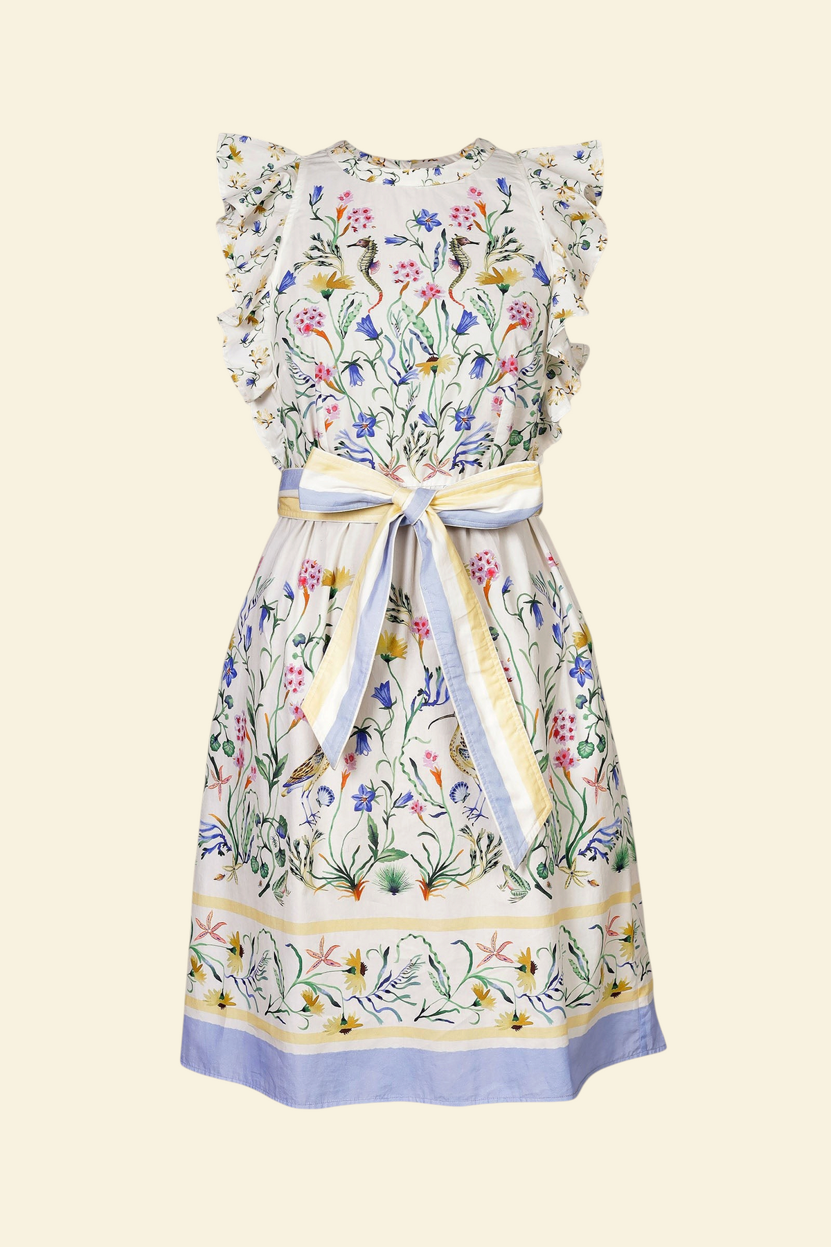 Banjanan Bulbul dress in Tidepool Grotto print with ruffled shoulders, floral pattern, and blue and yellow stripe belt.