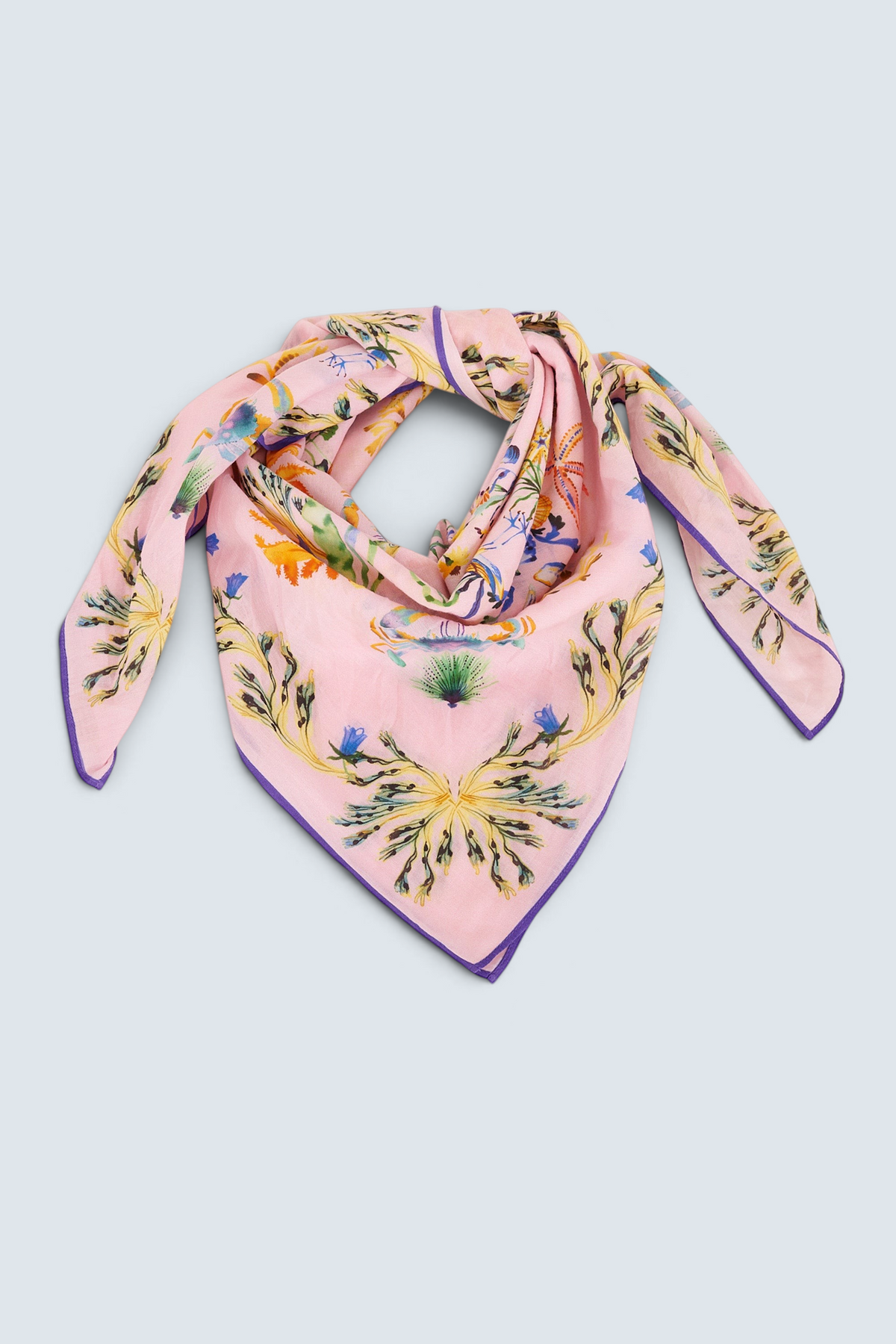 The Carolina scarf in the Tidepool print featuring starfish, seahorse, and shell motifs.