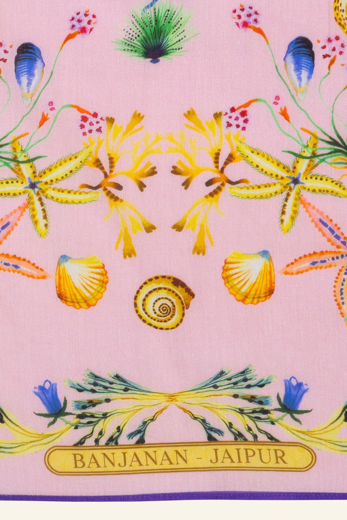 Close up detail of flat lay of Carolina scarf featuring Tidepool print with starfish, seahorses, and shells in ocean-inspired tones.