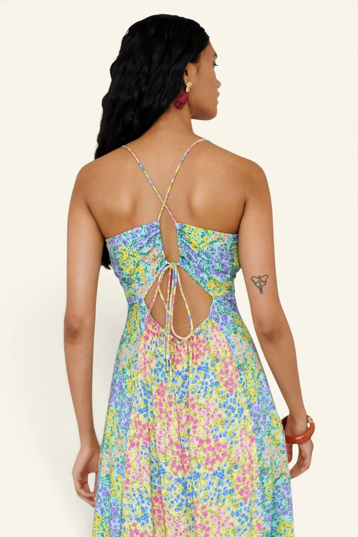 Banjanan Davina floral maxi dress with crossed tie-back straps and paneled skirt in blue, yellow, and pink ditsy print