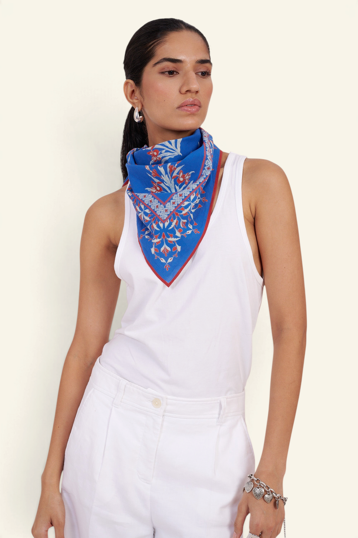 Banjanan Frances Scarf in blue cotton voile with hand-screened Brigitte iris floral print worn as a neckerchief