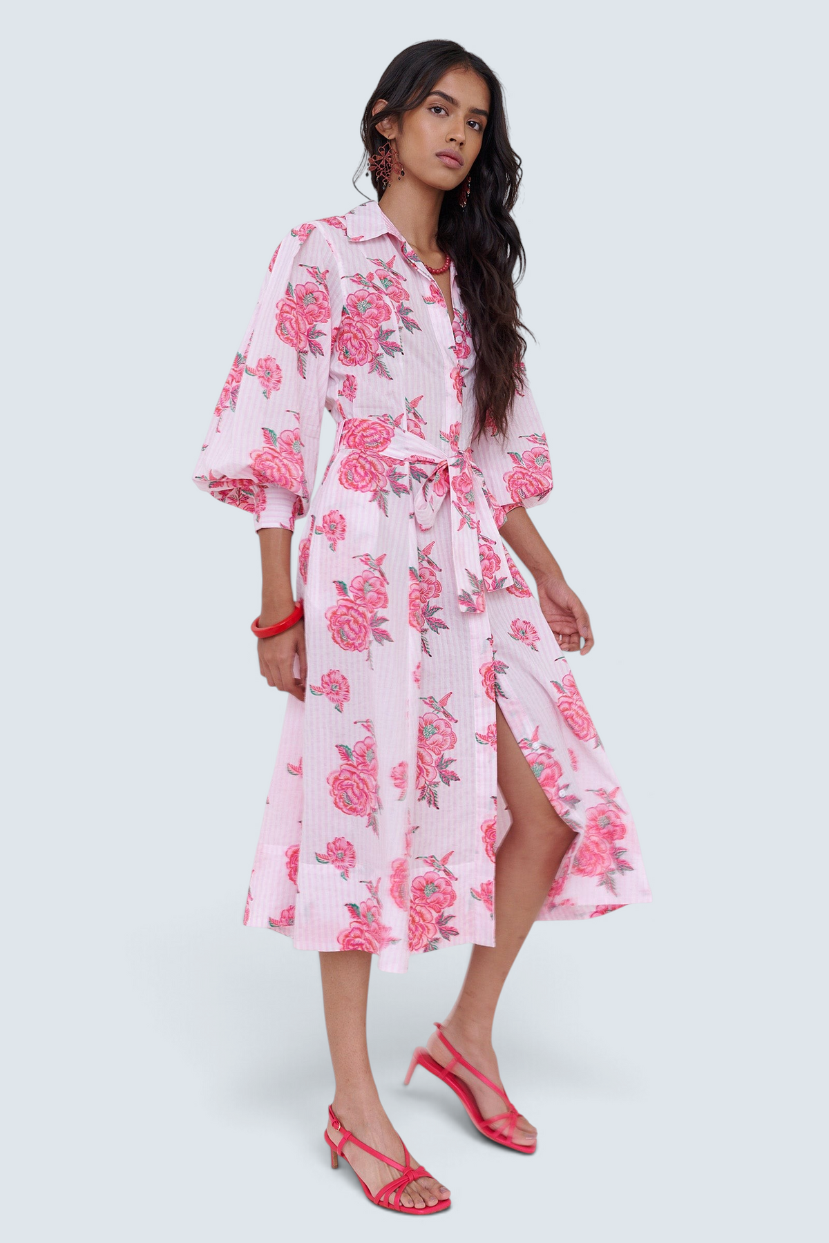 Banjanan Harris shirt dress in Eliza Rose Prism print with pink floral pattern, belted waist, and puff sleeves.