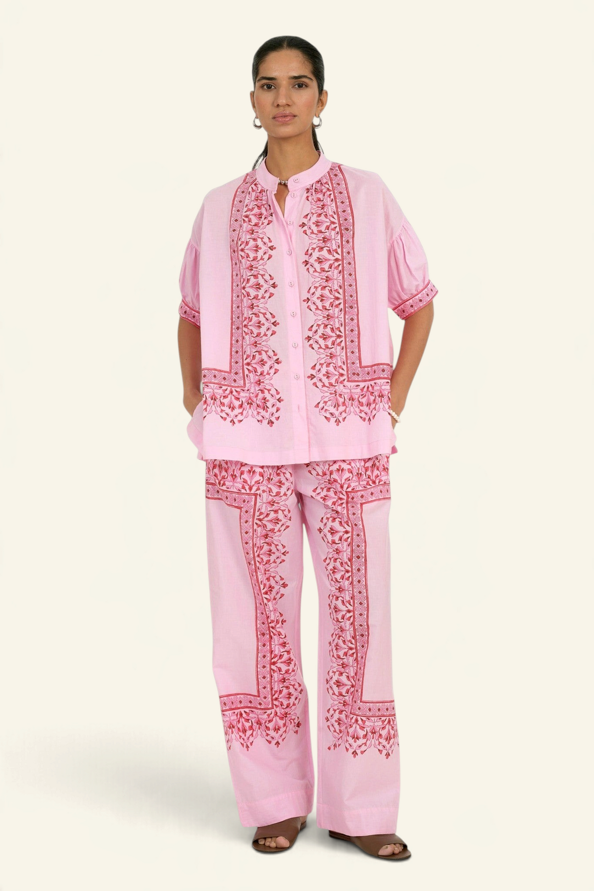 Model wearing Banjanan Ivan pant and Ivy shirt in pink Brigitte Bonbon geometric floral block print cotton