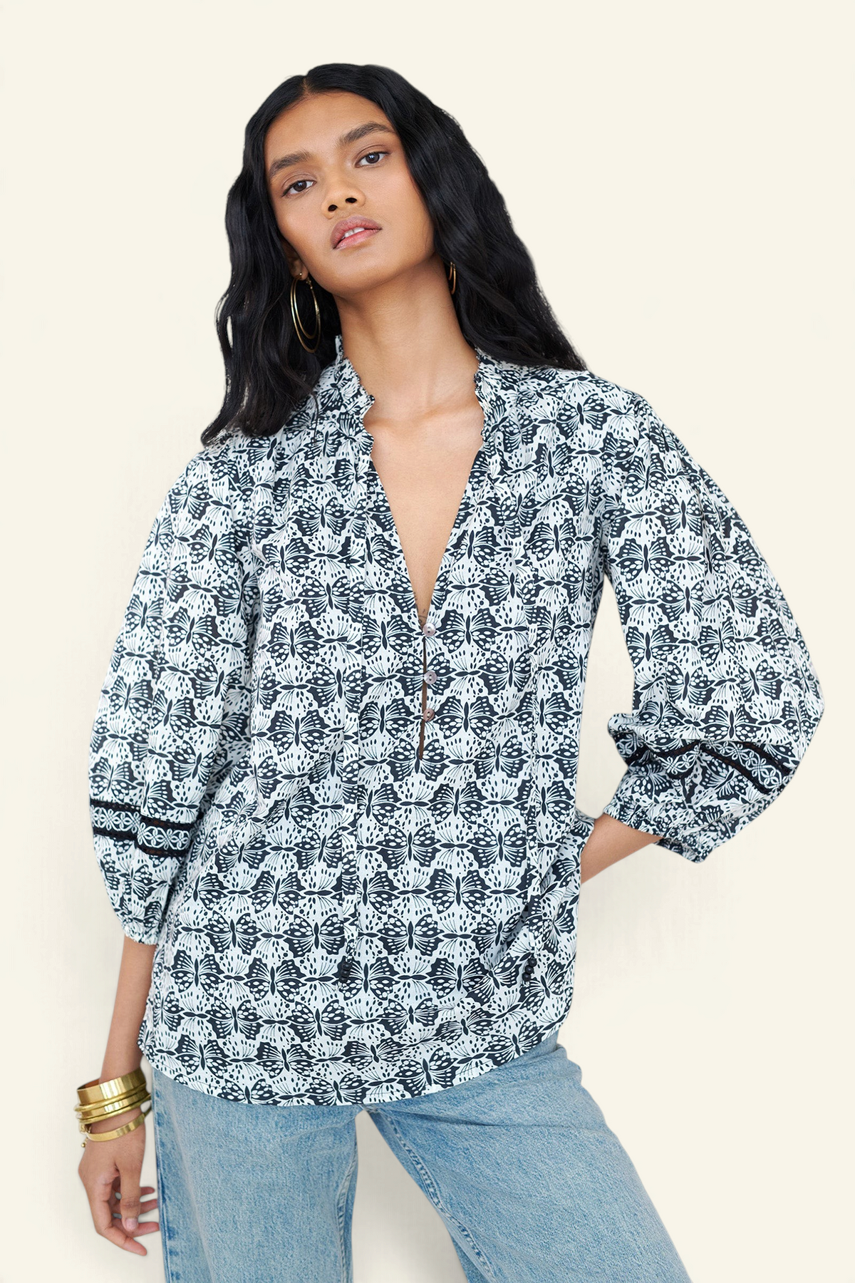 Banjanan Lorna top in black and white butterfly print cotton voile with v-neck, ruffle detail, and lace sleeves.