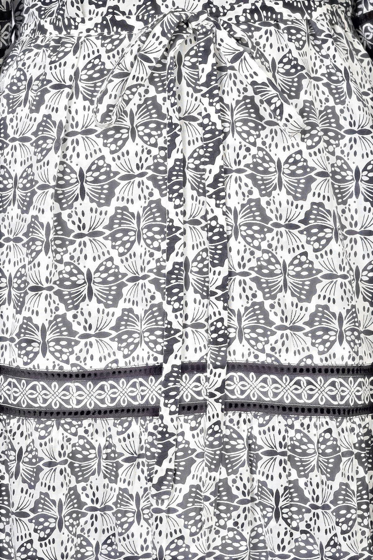 Banjanan Liza dress in white cotton voile featuring a black geometric butterfly print and delicate lace trim detail.