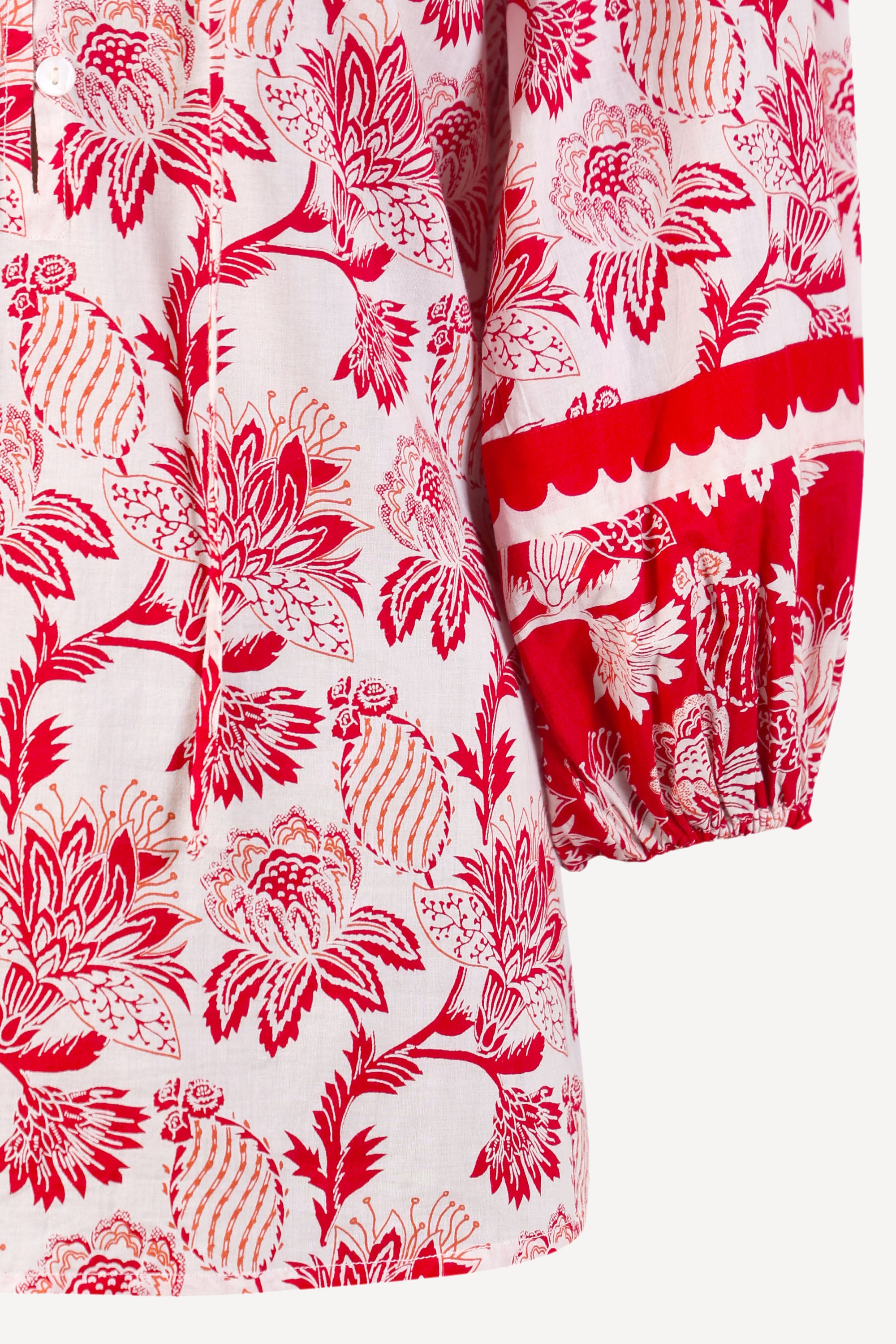 Close up of the Lorna top in the Lizzie print, featuring voluminous sleeves, and winding floral vine motifs.