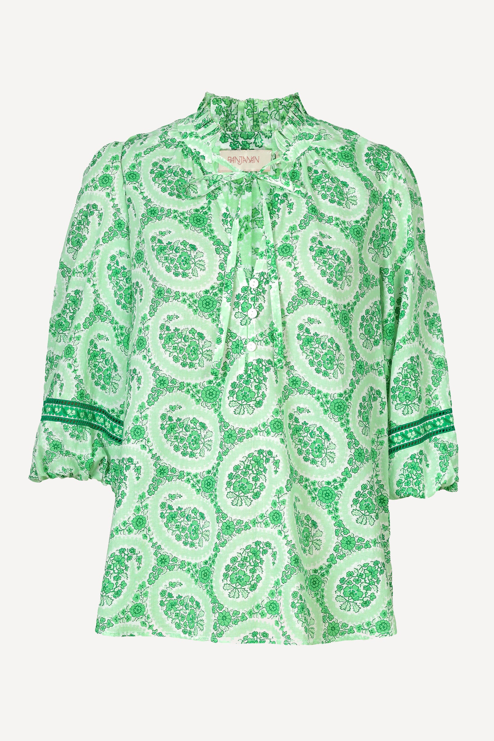 Ghost image of a green paisley Lorna blouse with ruffled tie neckline, button front, and contrast-trimmed sleeves.