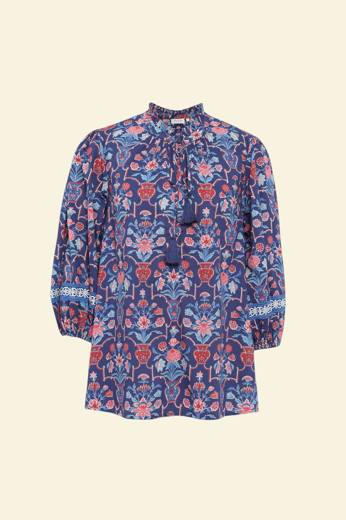 Front of Banjanan Lorna top in medieval blue cotton voile with floral vase print, v-neck, ruffle detail, and lace trim sleeves.