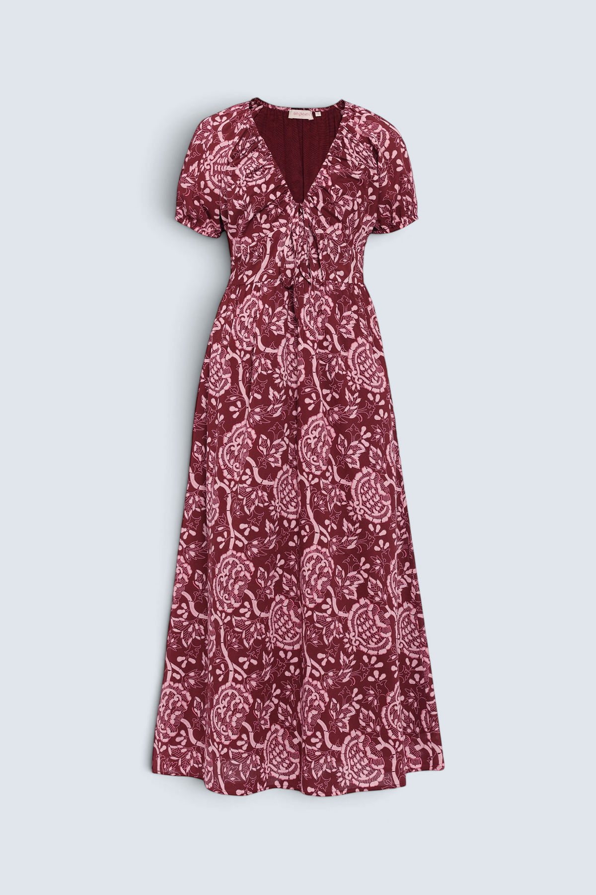 Front of Banjanan Norma dress in chocolate Coromandel floral print with drawstring neckline, puff sleeves, and princess seams.