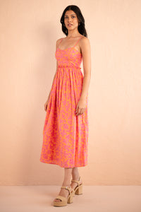 Side view of model posing wearing Phoebe Dress in Gaia Nectarine print. Side view of model posing wearing Phoebe Dress in Gaia Nectarine print.