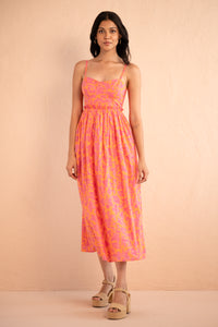 Front view of model posing wearing Phoebe Dress in Gaia Nectarine print. Front view of model posing wearing Phoebe Dress in Gaia Nectarine print.