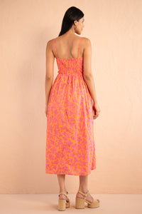Back view of model posing wearing Phoebe Dress in Gaia Nectarine print. Back view of model posing wearing Phoebe Dress in Gaia Nectarine print.