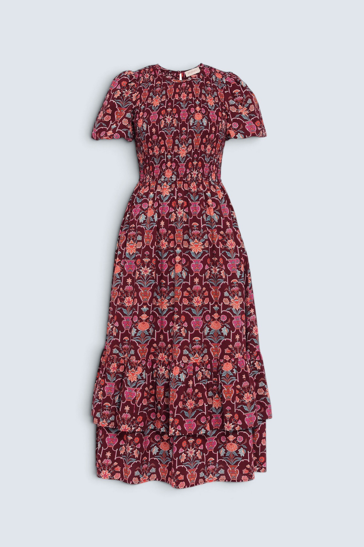 Front view of the Quant dress in Floral Vase print on a white background. It features a smocked bodice, puffed sleeves, and a full tiered skirt with pockets.