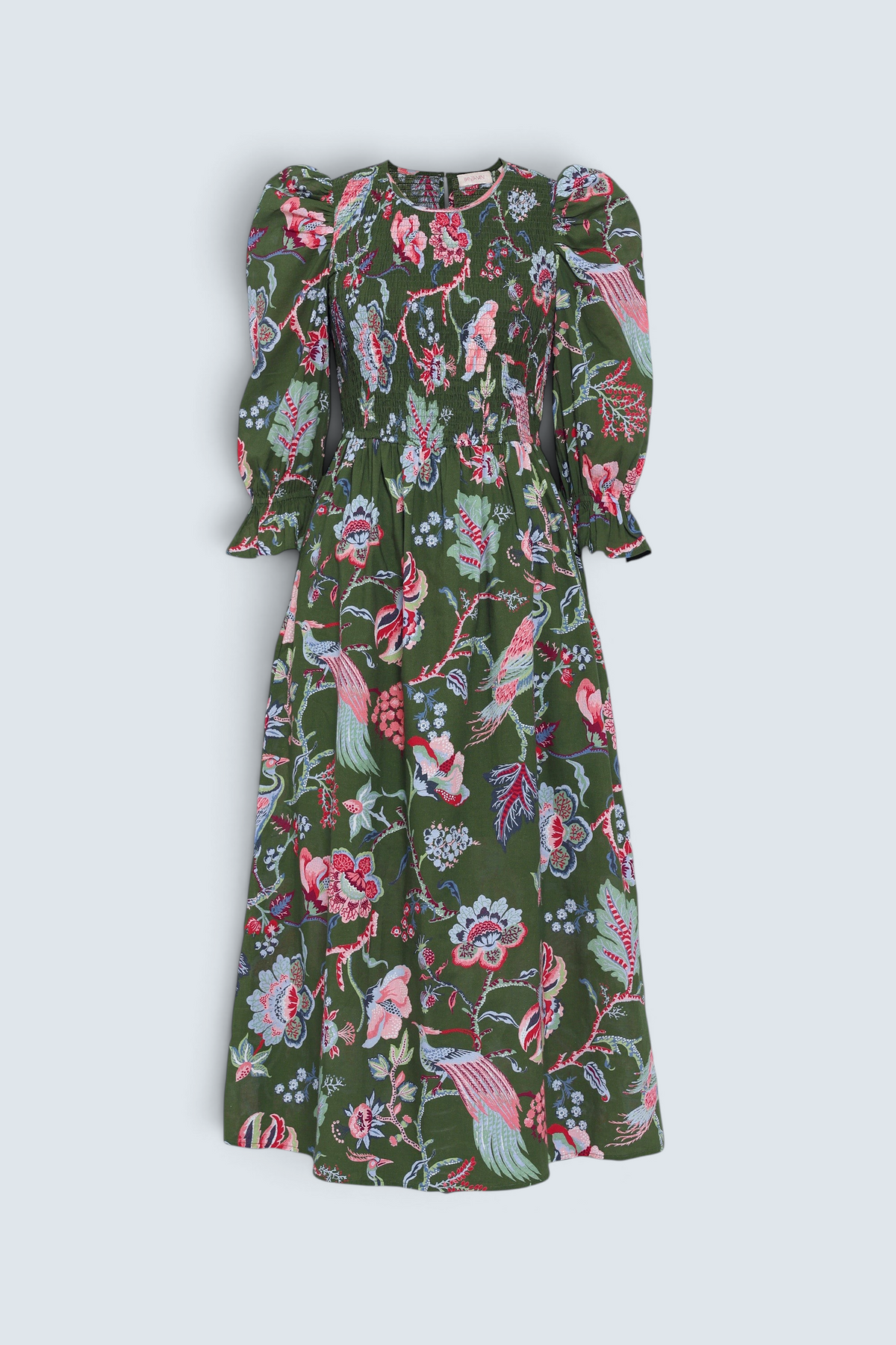 Banjanan Queenie dress in moss green with chintz floral print, smocked bodice, and puff sleeves.