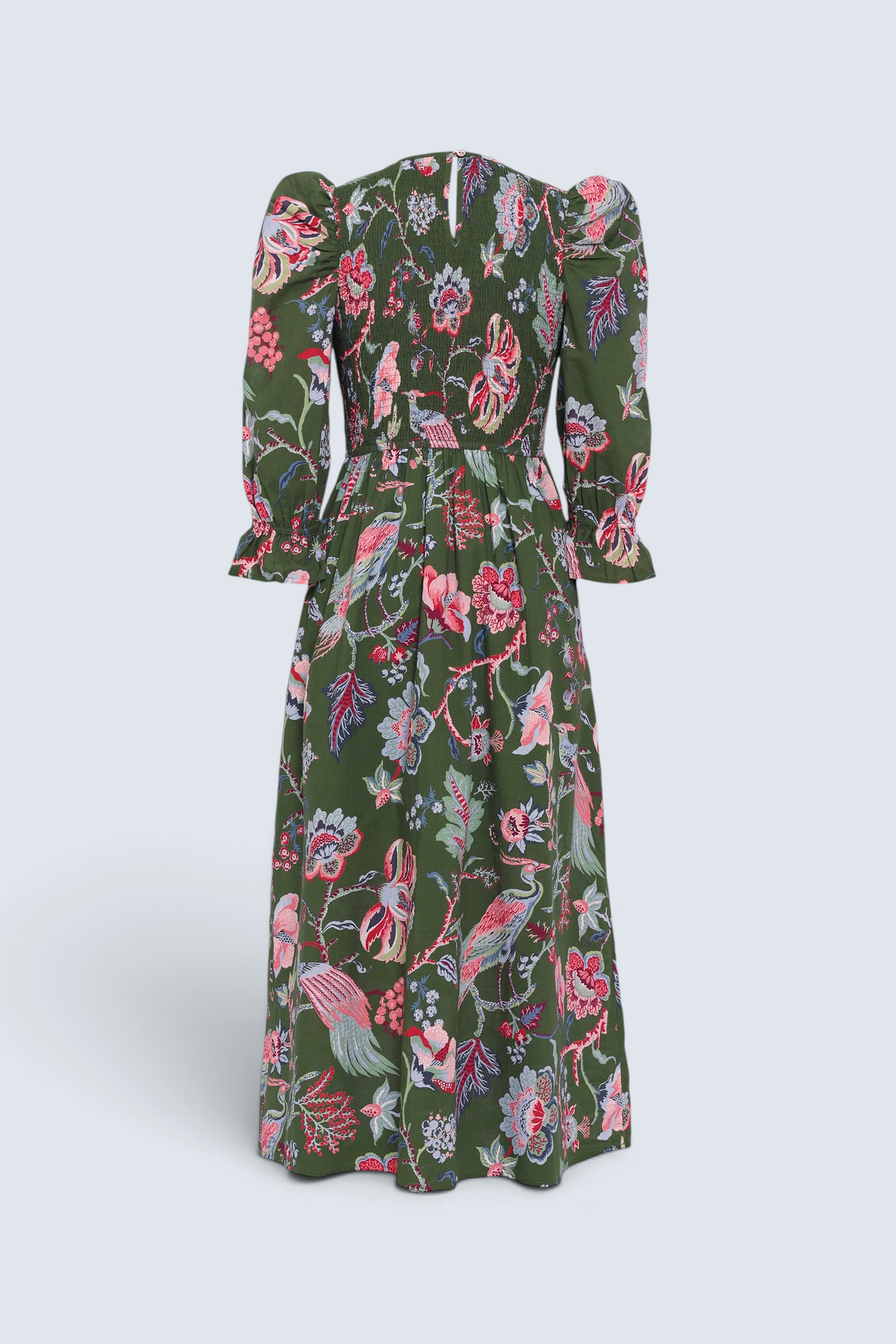 Banjanan Queenie dress in moss green with floral chintz print, smocked bodice, and puff sleeves, back view.