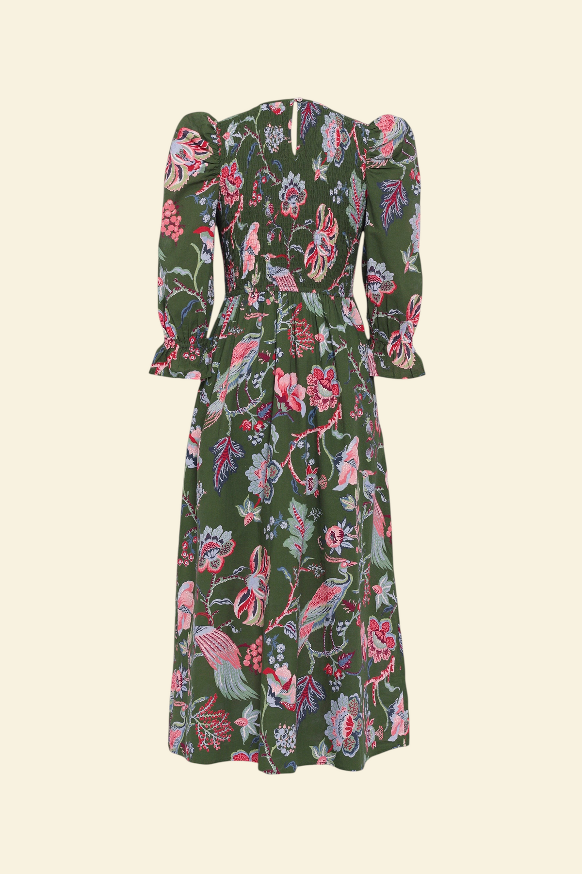 Banjanan Queenie dress in moss green with floral chintz print, smocked bodice, and puff sleeves, back view.