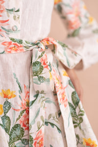 Close up detail of belt of Rowena Dress in Desert Rose Dawn print. Close up detail of belt of Rowena Dress in Desert Rose Dawn print.