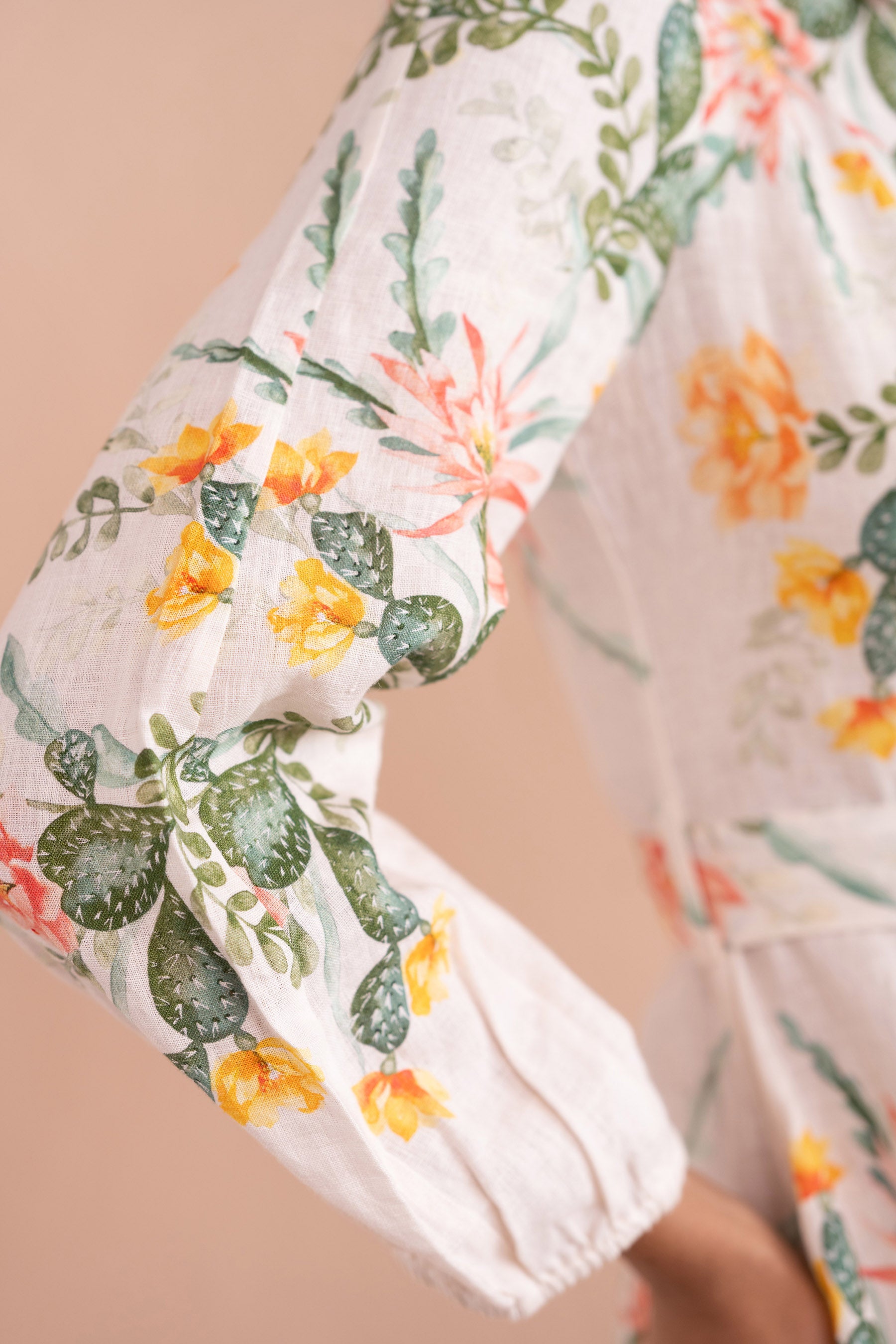 Sleeve close up of Rowena Dress in Desert Rose Dawn print in linen. Sleeve close up of Rowena Dress in Desert Rose Dawn print in linen.