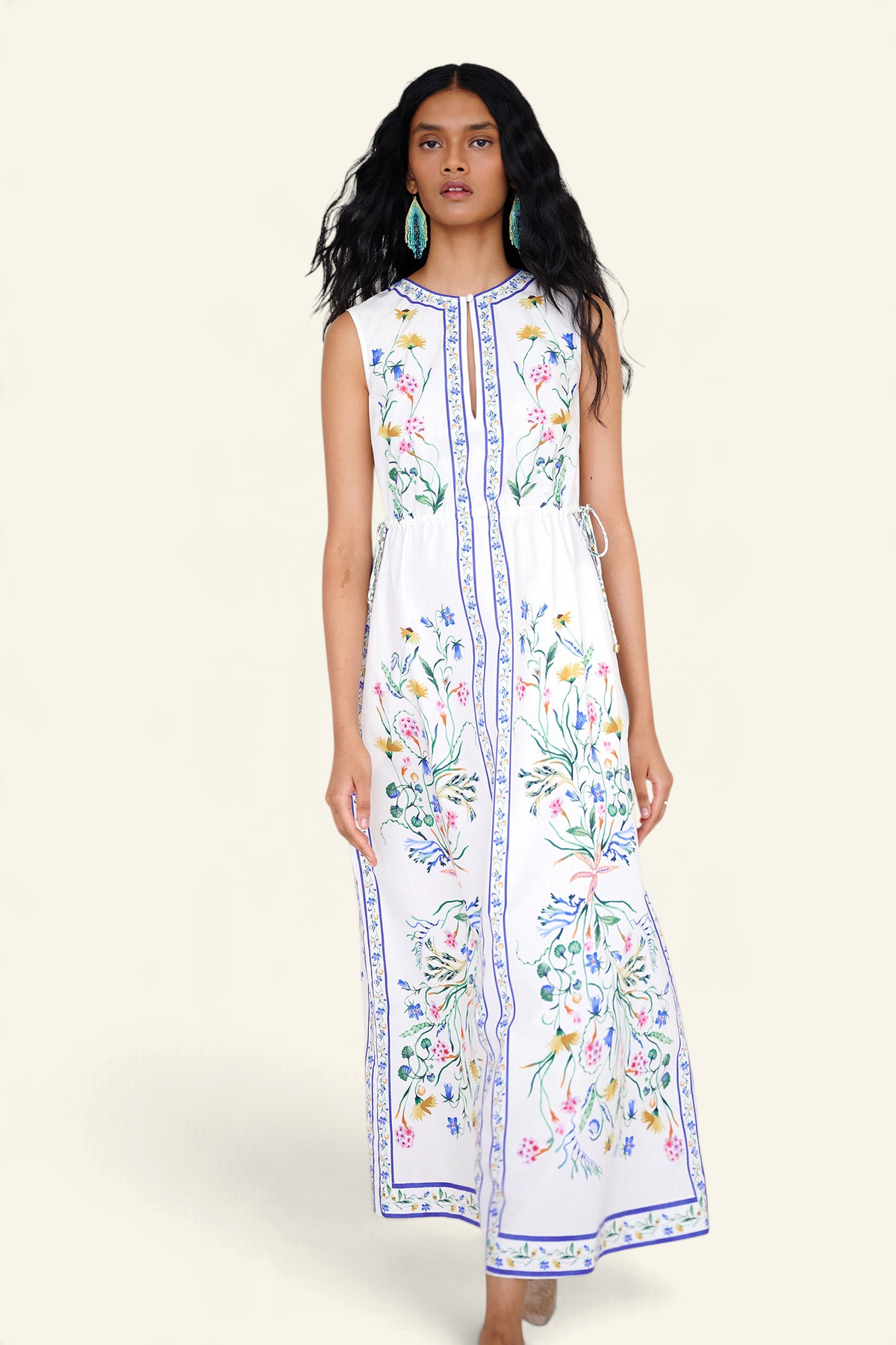 Banjanan Rhonda column dress in white with Tidepool floral print, keyhole neckline, and side drawstring details.