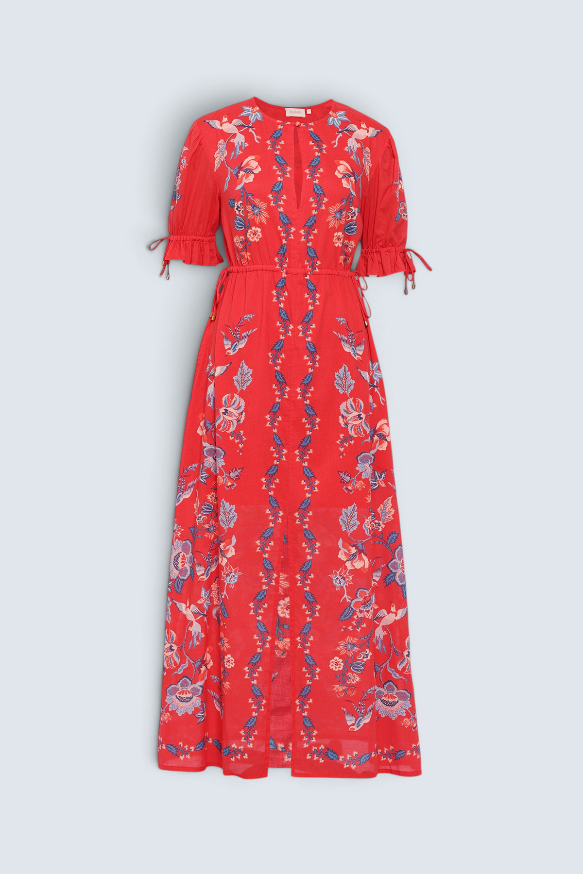 Banjanan Ruby dress in scarlet red with a vintage chintz floral print, keyhole neck, and adjustable drawstring sleeves.