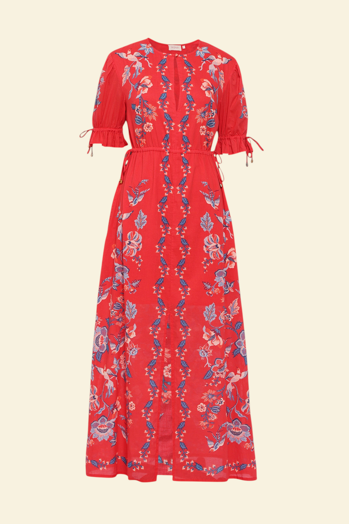 Banjanan Ruby dress in scarlet red with a vintage chintz floral print, keyhole neck, and adjustable drawstring sleeves.