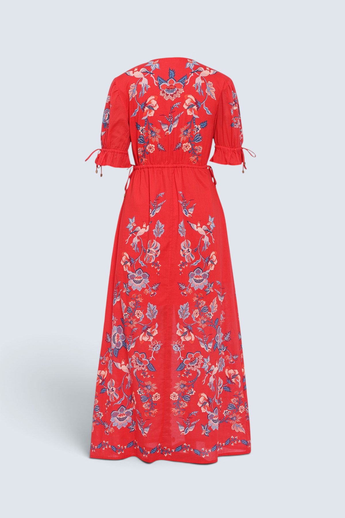 Banjanan Ruby dress in scarlet red with a vintage chintz bird and floral print, featuring drawstring sleeves.