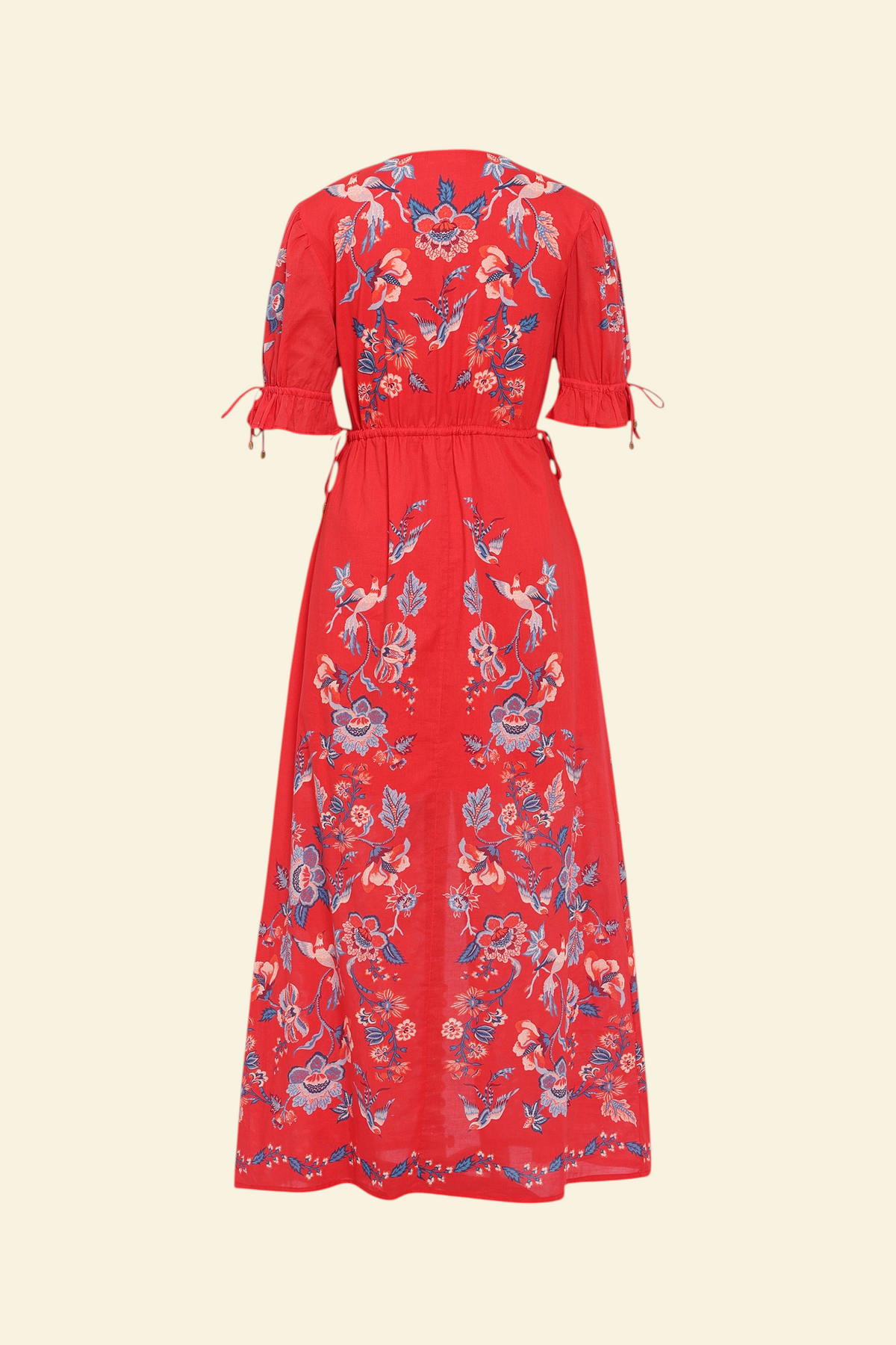 Banjanan Ruby dress in scarlet red with a vintage chintz bird and floral print, featuring drawstring sleeves.