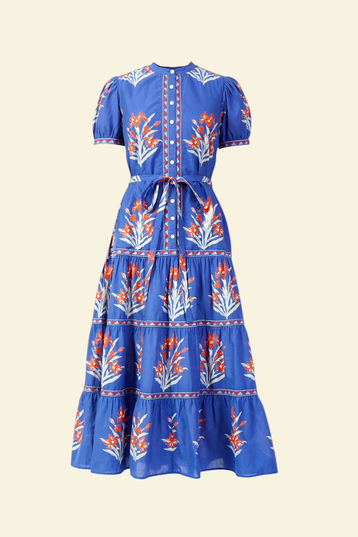Front view of the Saylor dress in the Brigitte print, featuring a full-length shirtdress silhouette, tiered skirt, detachable belt, and hand-screen-printed iris floral motifs.