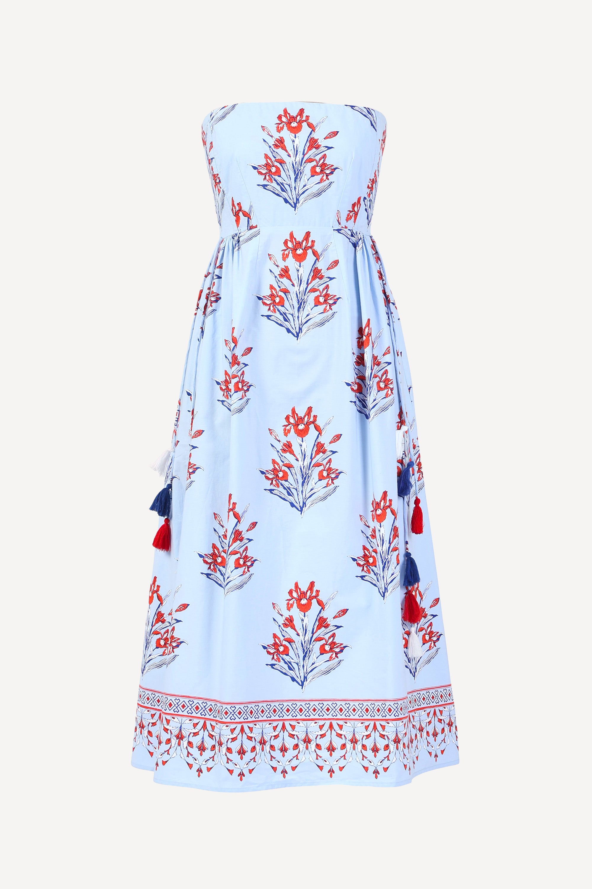 Front view of the Simona dress in the Brigitte floral print, featuring a strapless bodice, full gathered skirt, and red, white, and blue iris motifs.