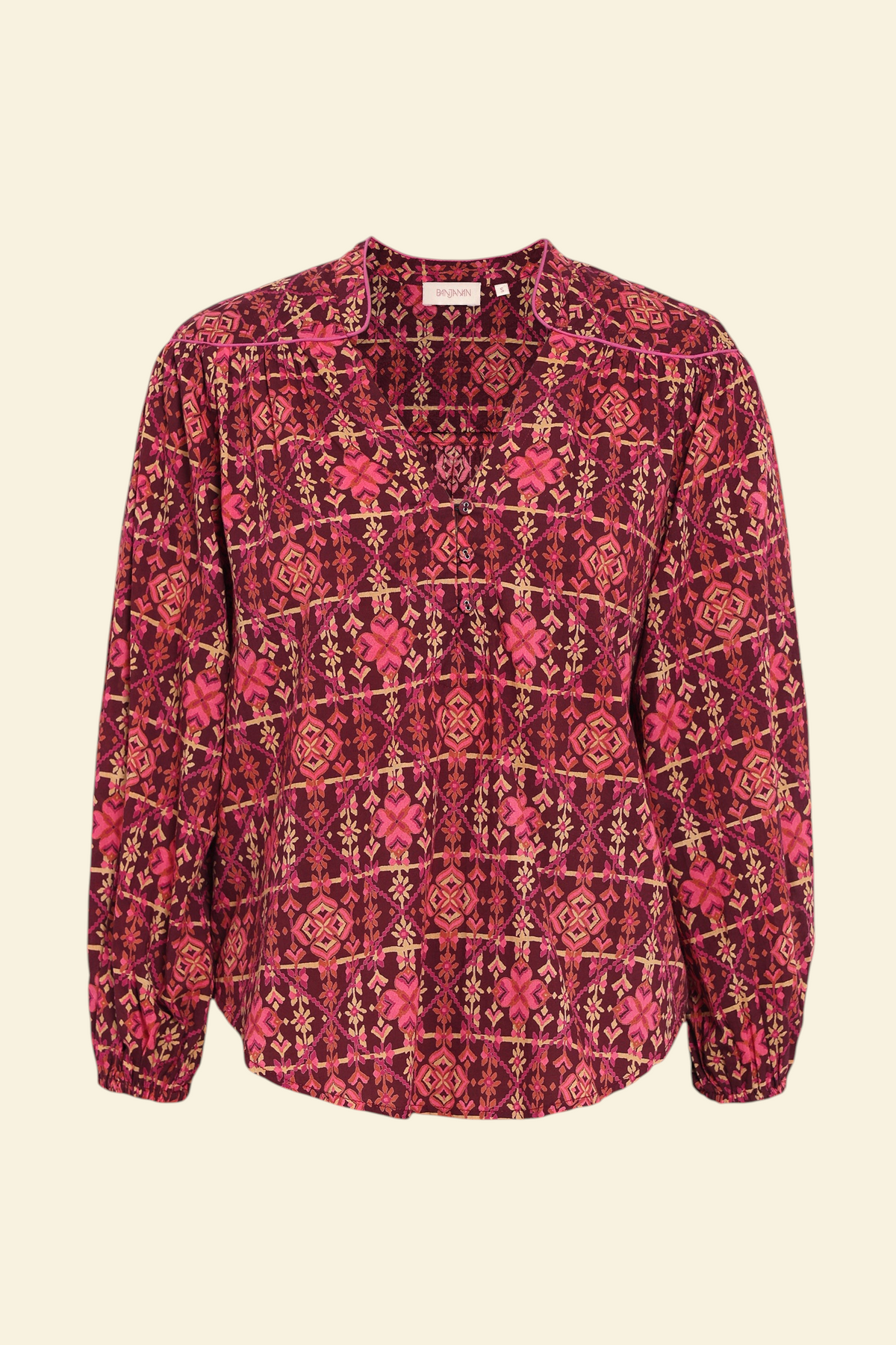 Banjanan Vanessa top in mahogany cotton voile with a geometric needlepoint floral print, v-neck, and quilted details.