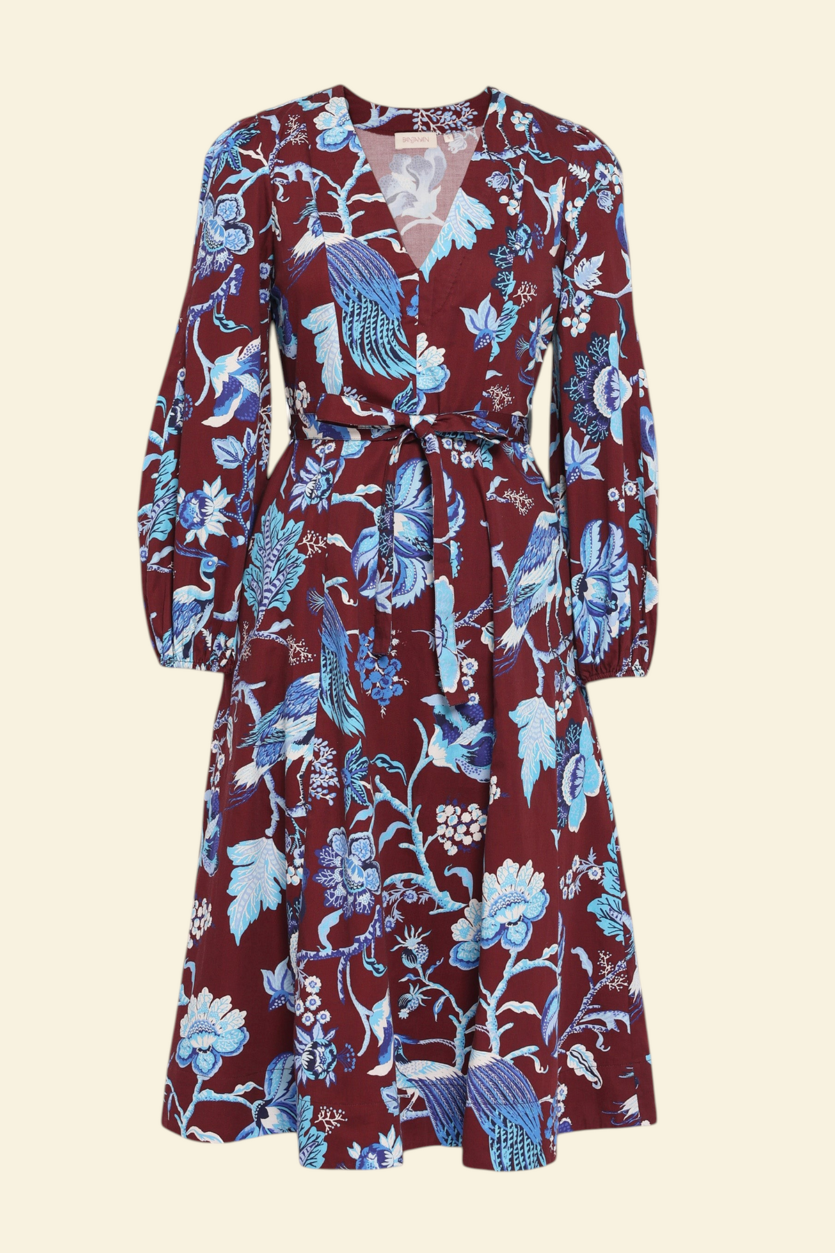 Front view the Zora dress in Chintz print, featuring a V-neck, lantern sleeves, princess seams, a gathered fit-and-flare skirt, fabric belt, and side-seam pockets.