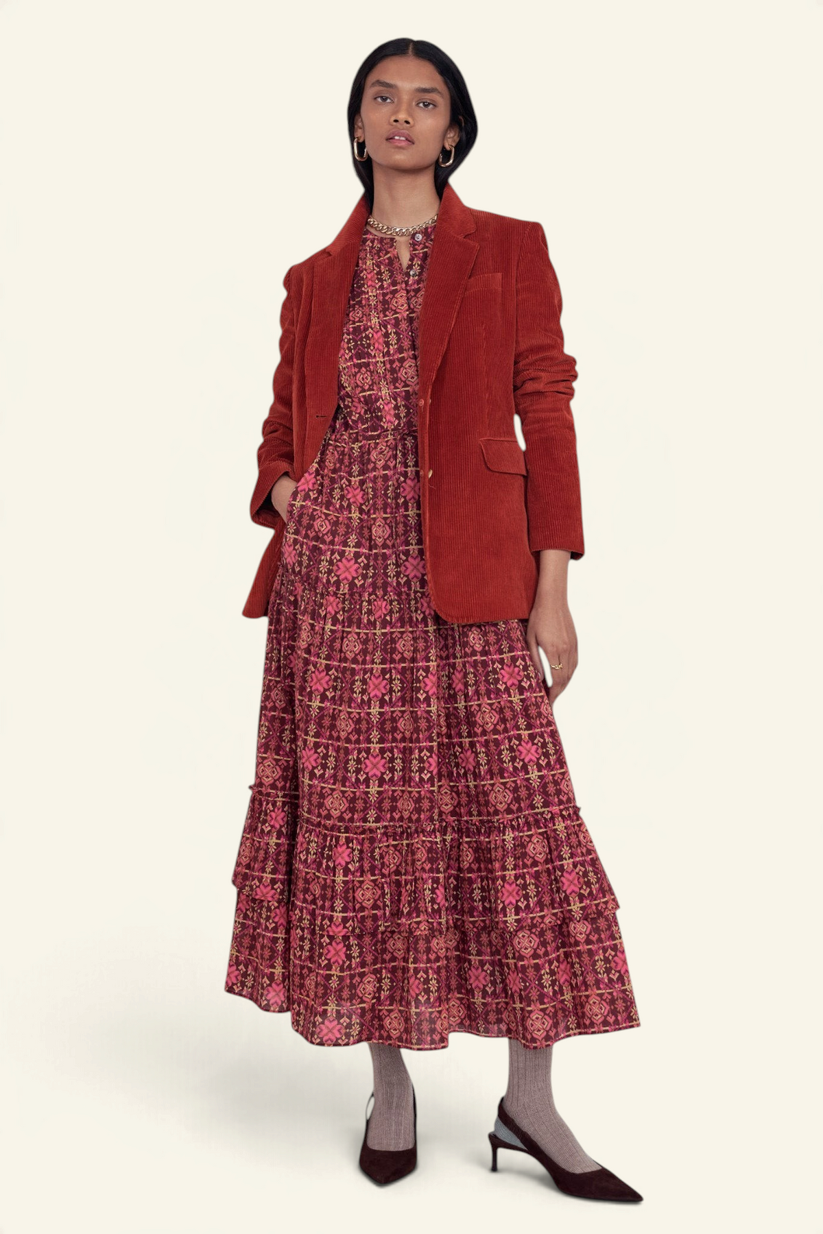 Banjanan Bazaar dress in mahogany needlepoint print cotton voile with tiered skirt, worn under a corduroy blazer.