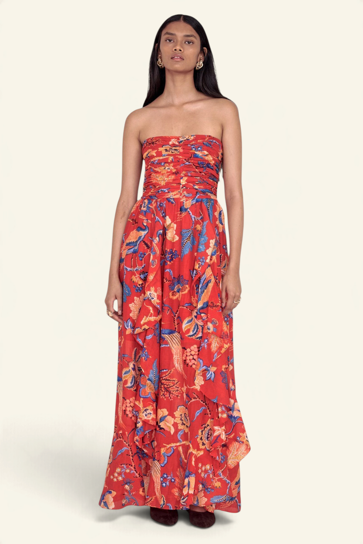 Banjanan Bella dress in red Chintz print with ruched bodice, cascading frilled skirt, and cotton silk fabric.