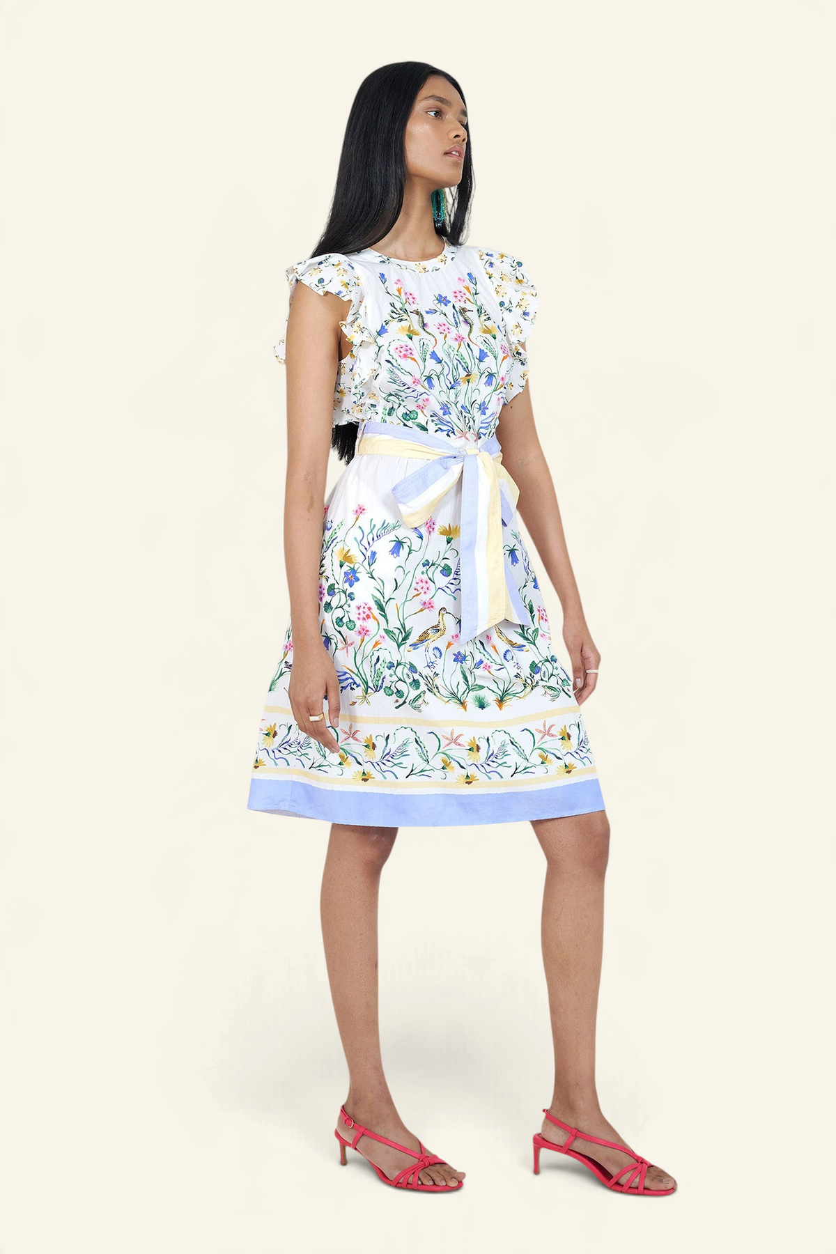 Woman wearing a floral dress with a white background