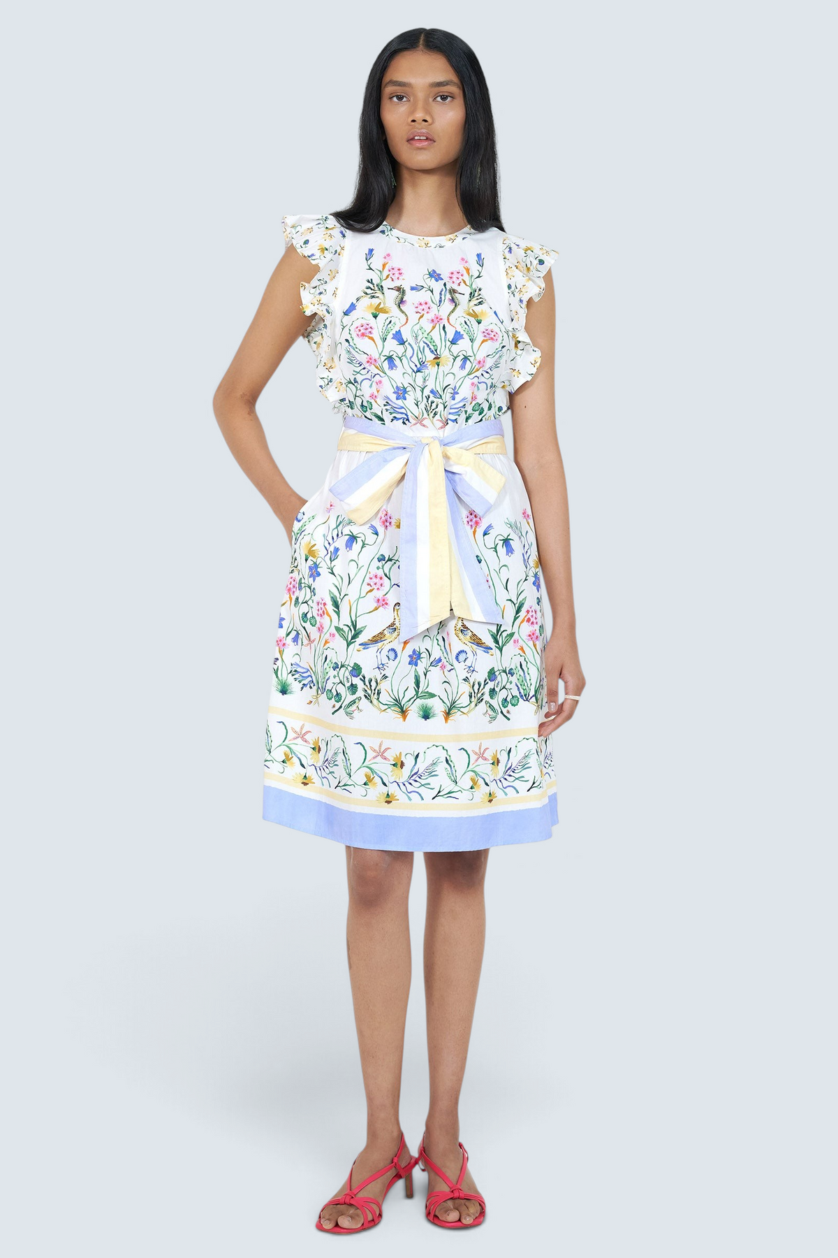Woman wearing a floral dress with a white background