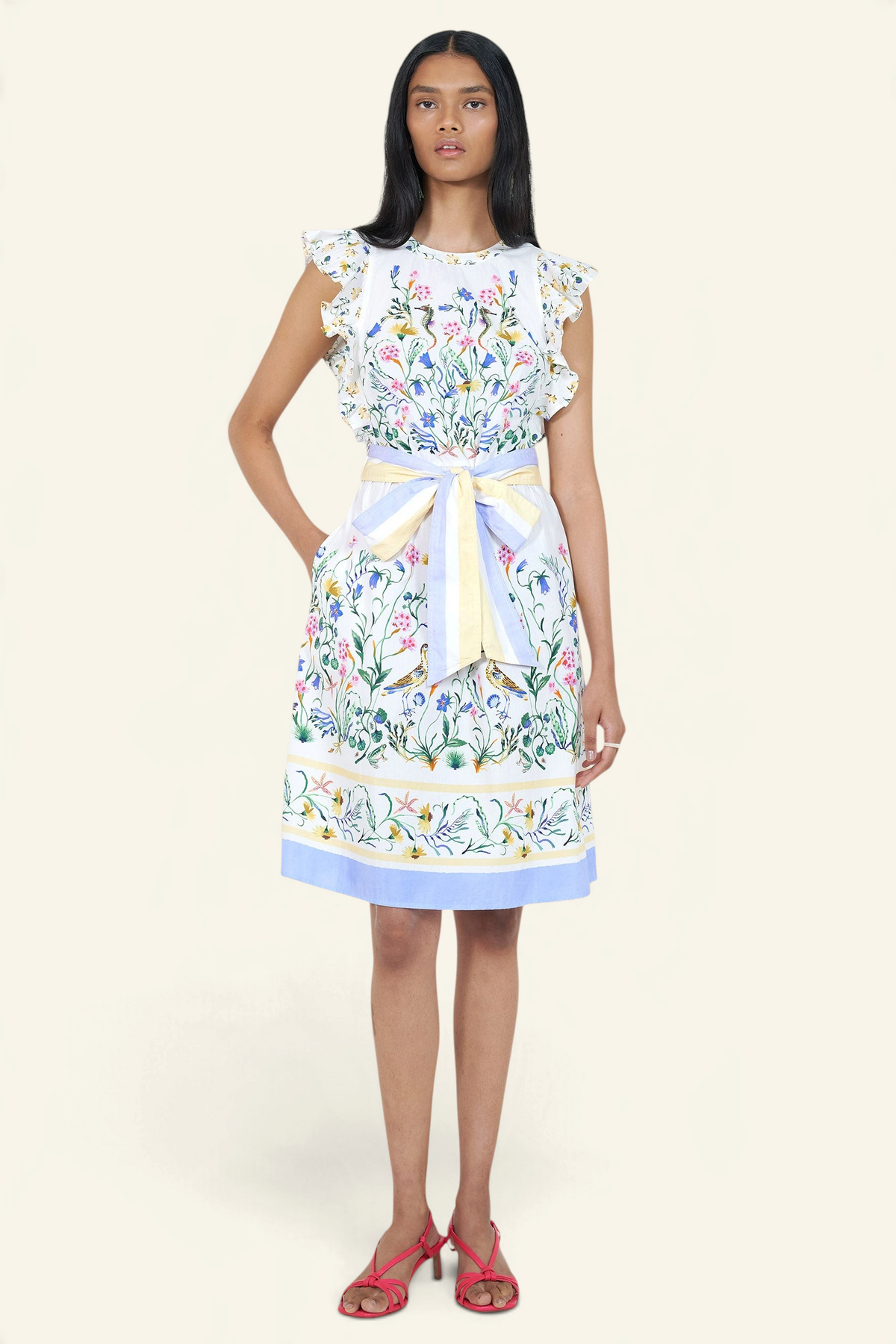Woman wearing a floral dress with a white background
