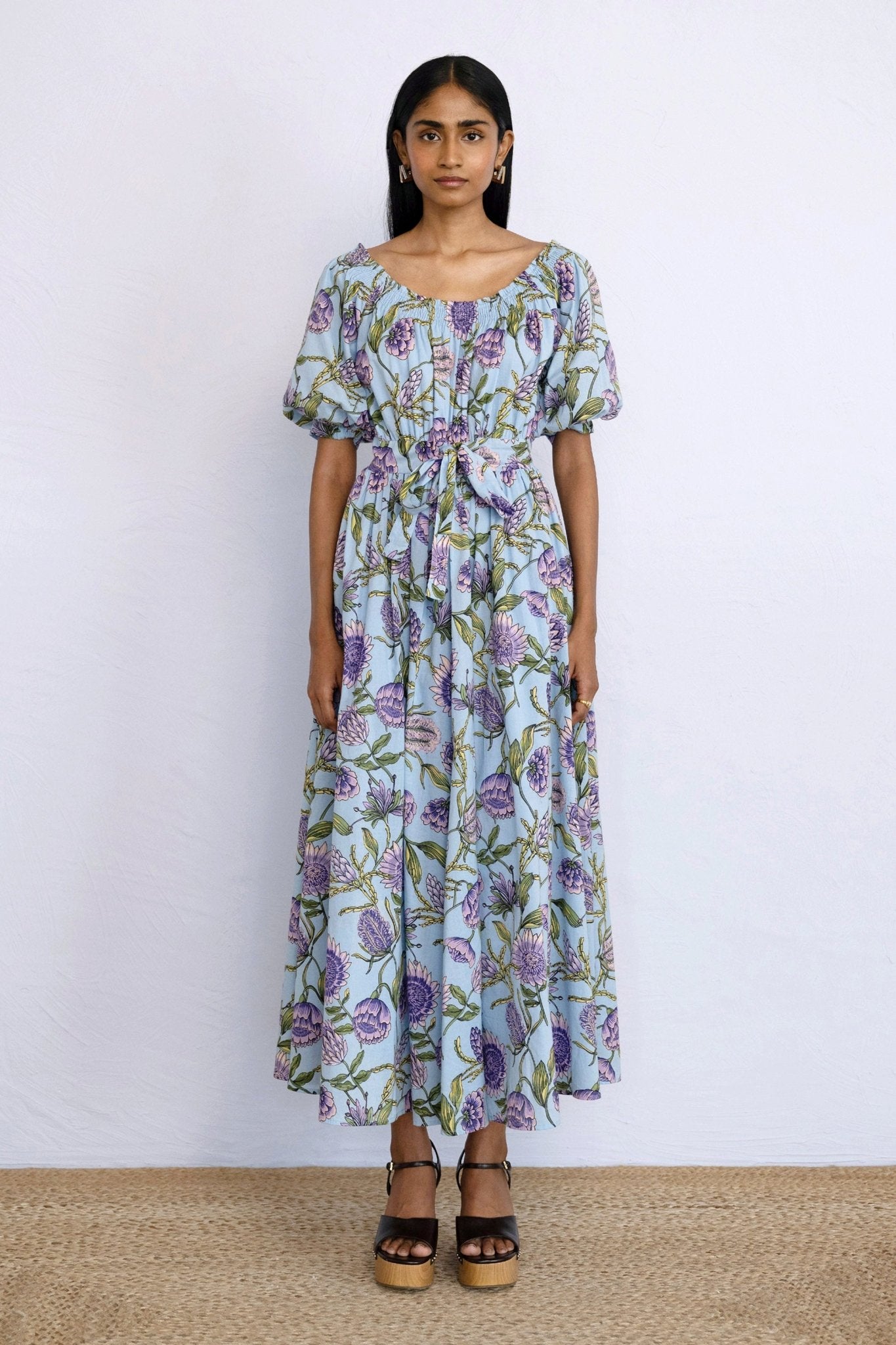 Front view of model standing straight wearing Heidi Dress in Protea Orchid print.