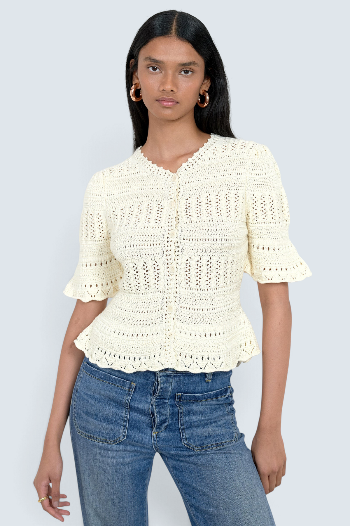 Banjanan Laura short sleeve ivory cotton cardigan with hand-crocheted trim and button front closure