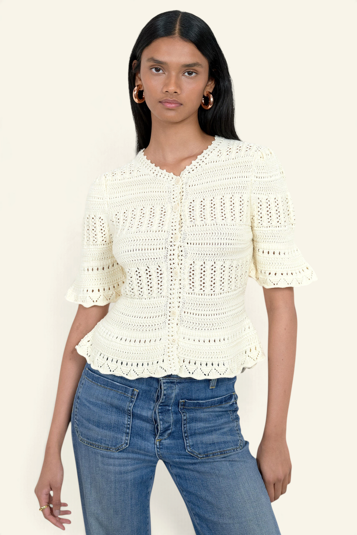 Banjanan Laura short sleeve ivory cotton cardigan with hand-crocheted trim and button front closure