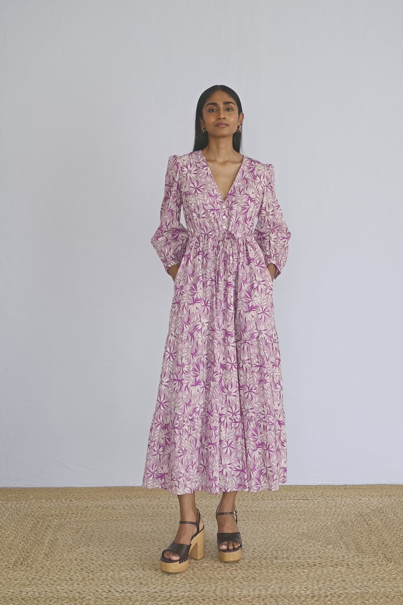 Video of model wearing a full length Castor Dress in Jacaranda Lilac print showing all sides of the dress.