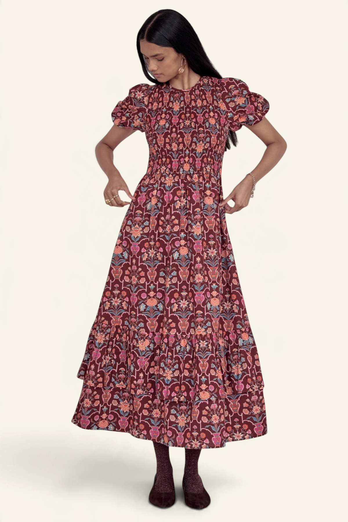 Banjanan Quant dress in chestnut floral vase print with a smocked bodice, puffed sleeves, and a tiered midi skirt.