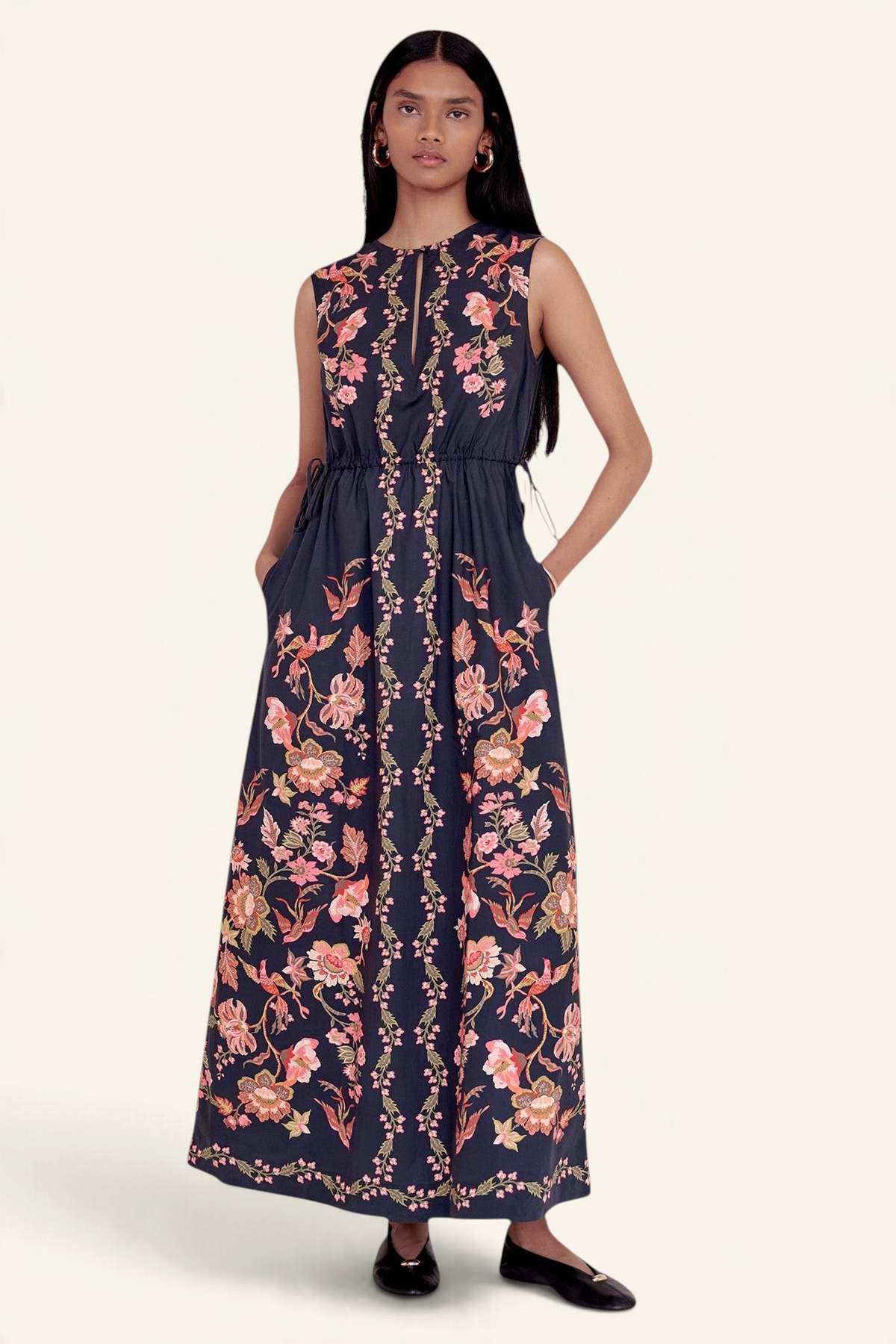 Banjanan Rhonda column dress in black with pink floral and bird print, featuring a keyhole neckline and side pockets.