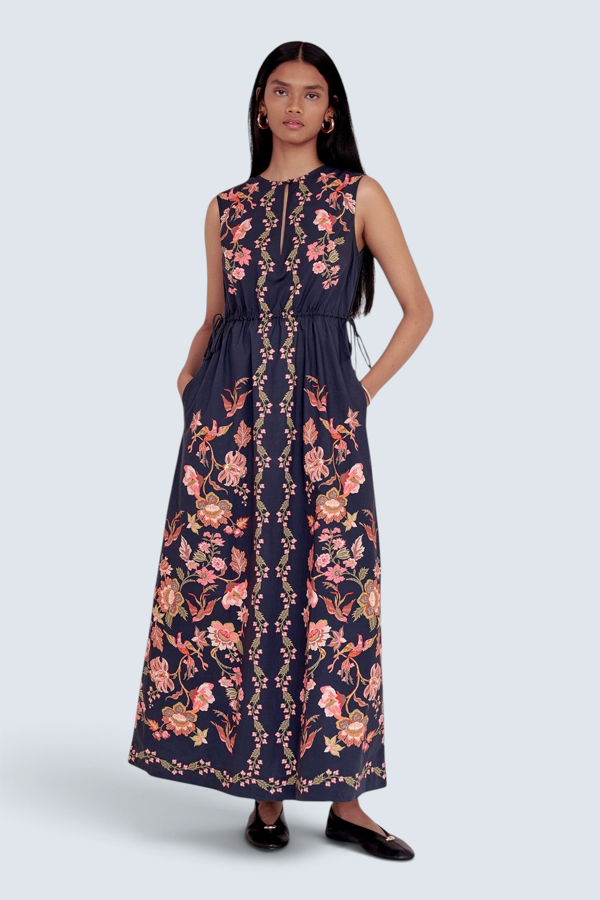 Banjanan Rhonda column dress in black with pink floral and bird print, featuring a keyhole neckline and side pockets.